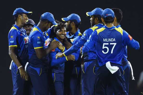 Akila Dananjaya (centre) mobbed after his dream spell. Akila Dananjaya (centre) mobbed after his dream spell.