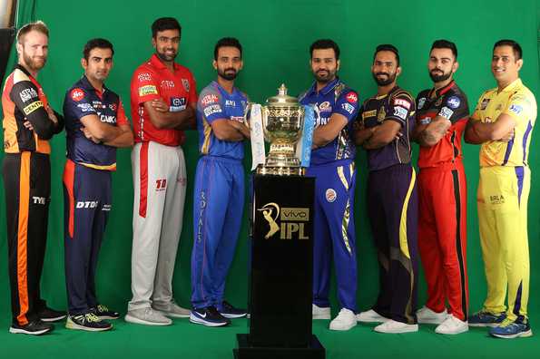 Should the captains standing the farthest move in closer towards the trophy? Should the captains standing the farthest move in closer towards the trophy?