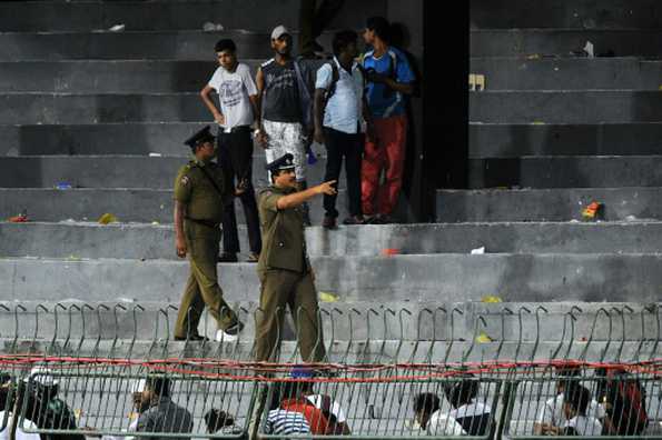 Sri Lankan police clear the terraces after groups of supporters of both sides clashed during the third ODI. Sri Lankan police clear the terraces after groups of supporters of both sides clashed during the third ODI.