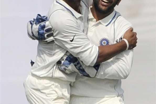Murali Vijay celebrates with Dhoni after taking a brilliant catch in the slips. Murali Vijay celebrates with Dhoni after taking a brilliant catch in the slips.