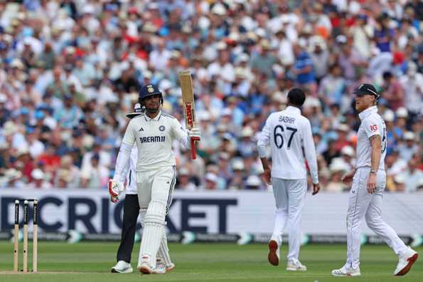 Shubman Gill raises his bat after reaching 150 