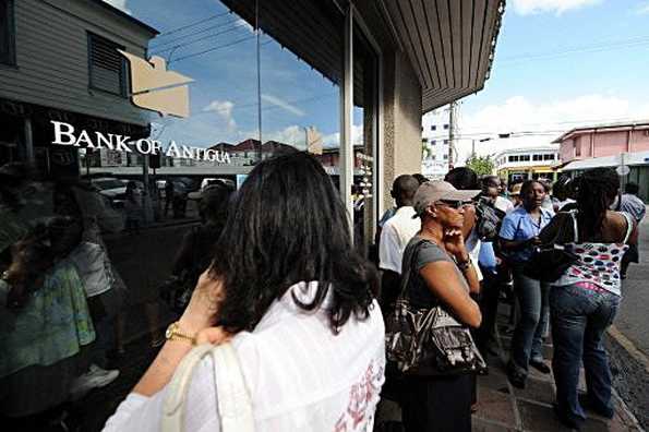 People queue outside a Stanford Group owned Bank of Antigua branch in St John's on February 18, 2009. Texas financier Allen Stanford, accused of a multibillion dollar fraud that prompted governments to shut down his banks and seize their assets, was located Thursday in Virginia, the FBI said. People queue outside a Stanford Group owned Bank of Antigua branch in St John's on February 18, 2009. Texas financier Allen Stanford, accused of a multibillion dollar fraud that prompted governments to shut down his banks and seize their assets, was located Thursday in Virginia, the FBI said.